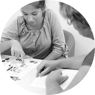 Black and white thumbnail of a young person doing an attention or cognitive test with a clinician, used for ADHD assessment