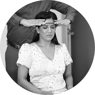 Black and white thumbnail of a clinician fitting a neurofeedback headband on a woman at Zen Waves Clinic